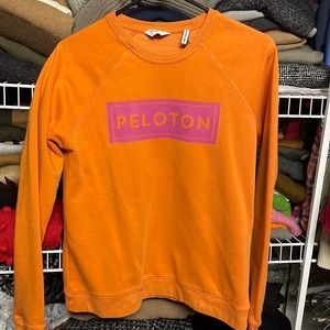 Orange Peloton sweatshirt